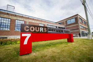 An outdoor picture of the front of the Bayview Yards building.