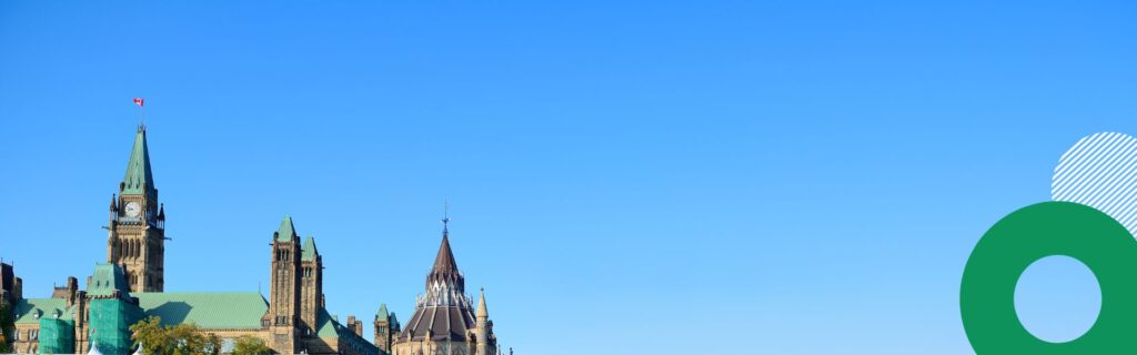 A feature image showing a blue sky above Parliament