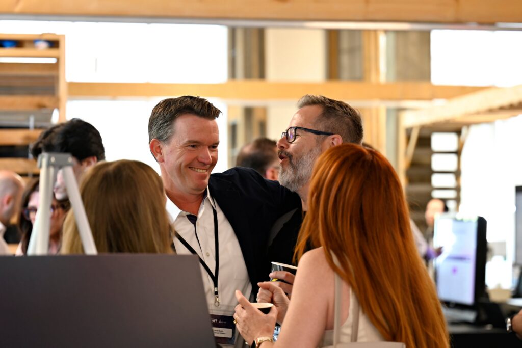 Professionals networking and connecting at a business event, representing collaboration and growth opportunities in Ottawa.
