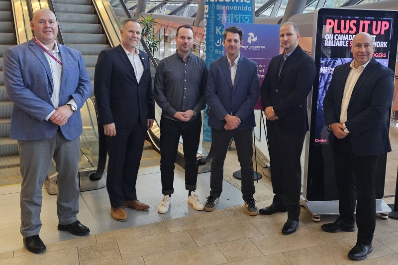 Group of business professionals at a networking event, representing industry collaboration and technology partnerships in Ottawa.