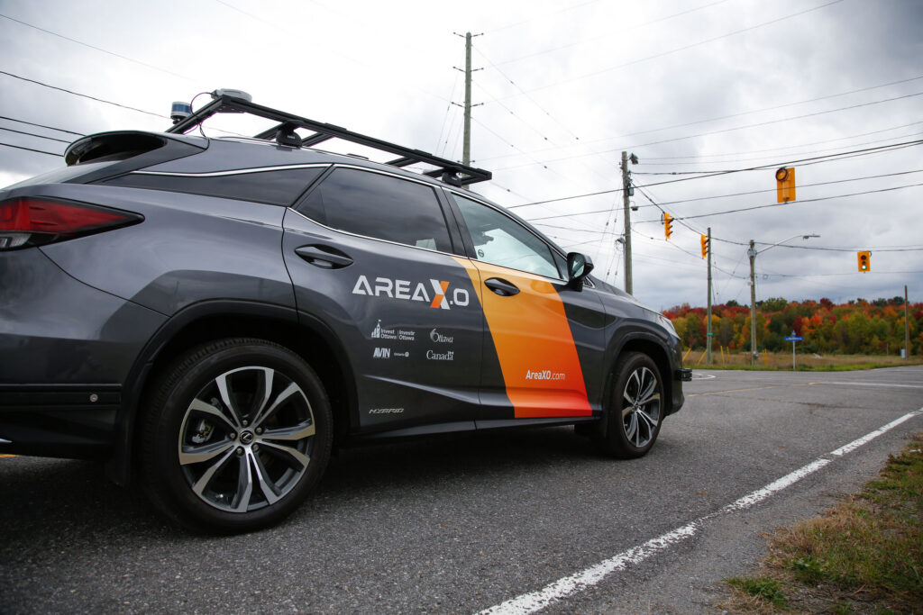 Connected vehicle equipped with sensors at Area X.O test site, representing autonomous mobility and smart transportation innovation.